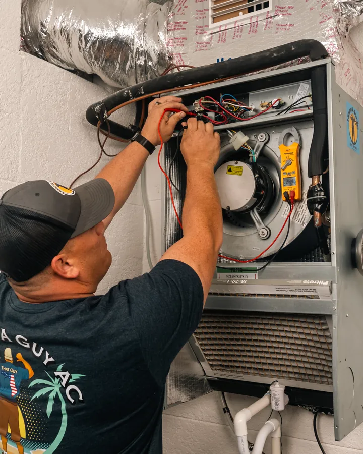 Technician servicing an air handler