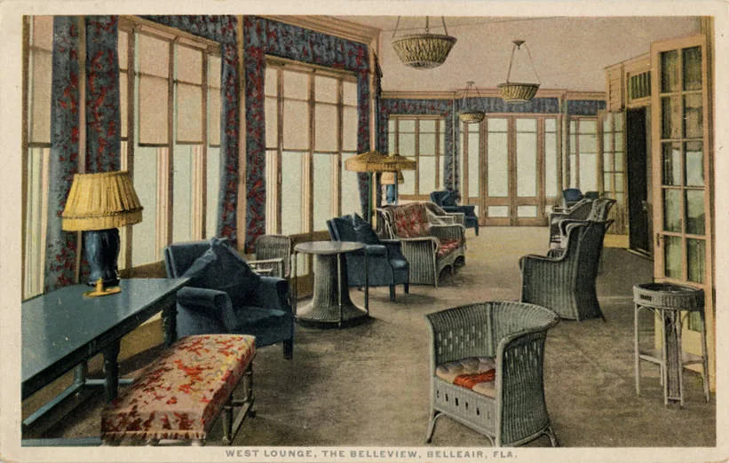 A large hotel lounge with columns, wicker furniture and rugs in a vintage postcard.